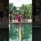 Hải Yến – The catwalk challenge on a wooden beam over the swimming pool.